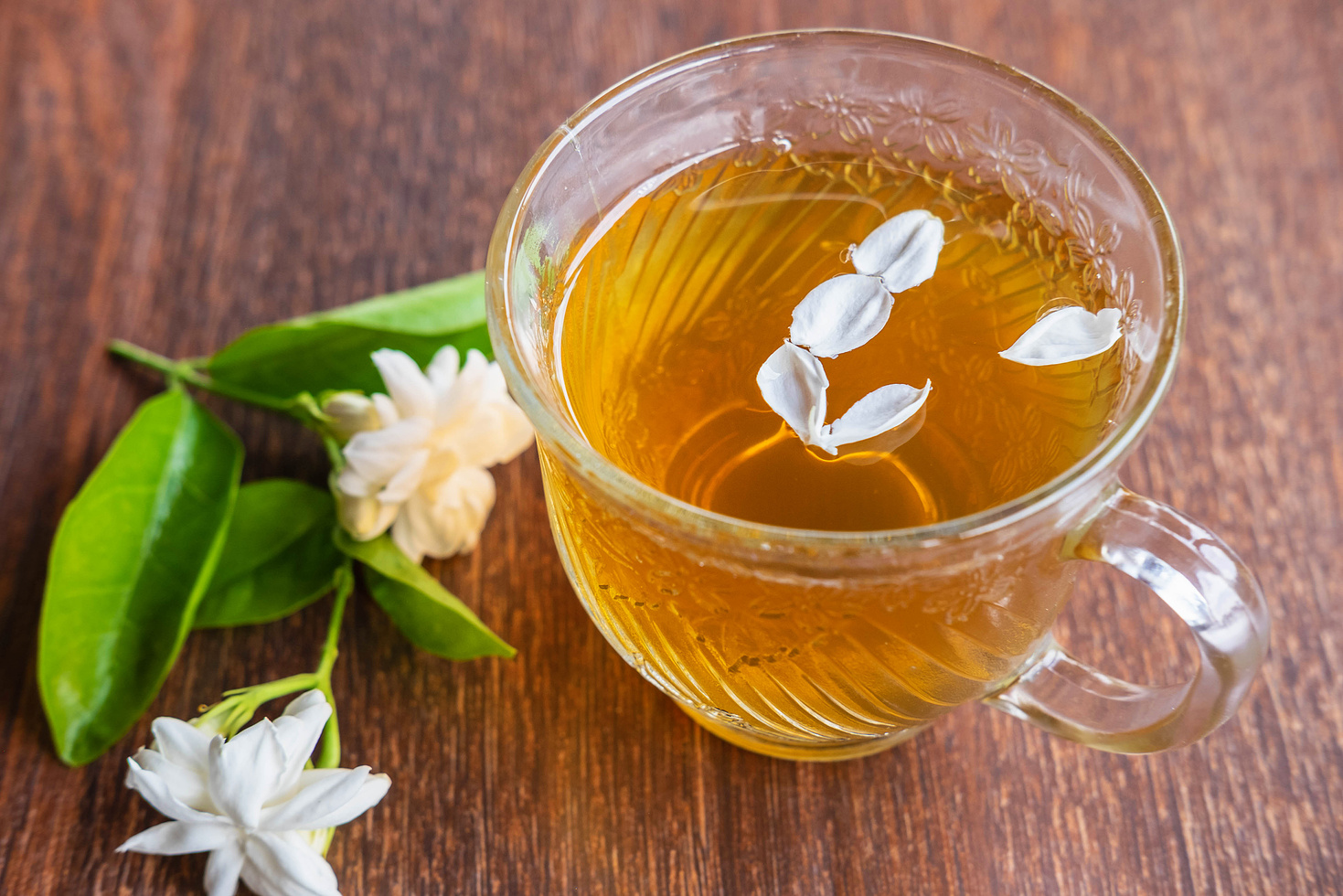 A cup of tea and flowers on the table